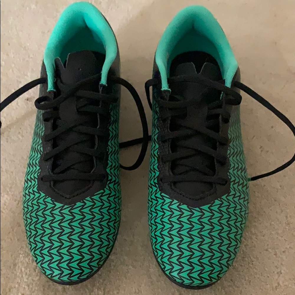 Green and black underarmour soccer cleats. Size 7